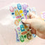 ARCHIVE Glitter Zipper Pocket + Care Bear Seal Sticker Set
